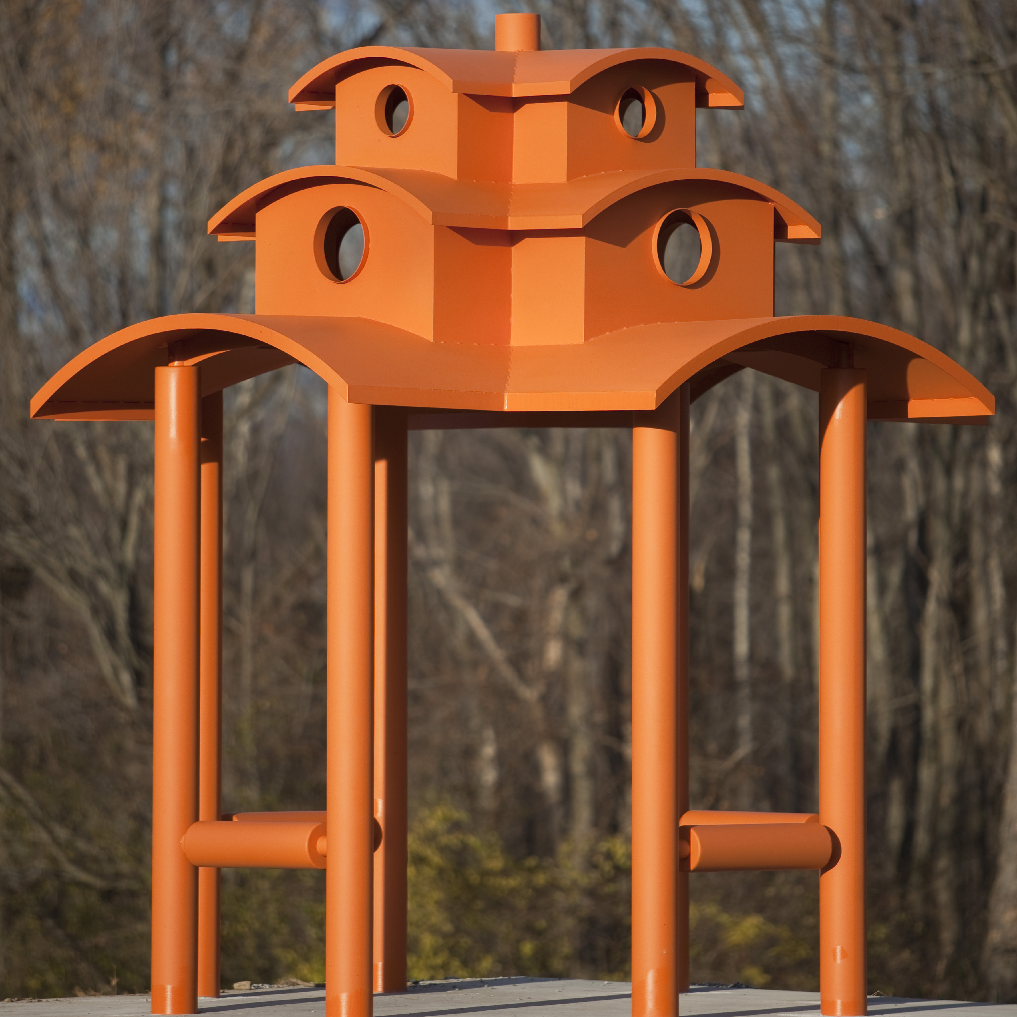 an orange gazebo-inspired sculpture